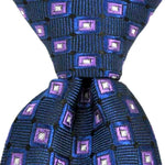 Load image into Gallery viewer, Blue necktie with purple and white diamond pattern, close-up of tie knot