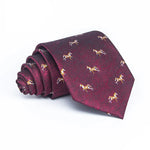 Load image into Gallery viewer, Matching burgundy ties with horse pattern, ideal for fathers and sons, rolled on white background.
