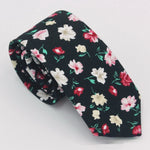 Load image into Gallery viewer, Black floral necktie with red, white, and beige flowers, men's fashion accessory
